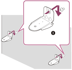 Pověste držáky pro připevnění na zeď tak, aby šrouby upevněné v kroku 5 procházely otvory držáků a držáky visely na šroubech.