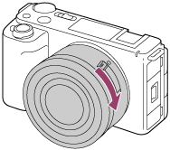 Illustration showing how to turn the lens clockwise with the camera facing toward you