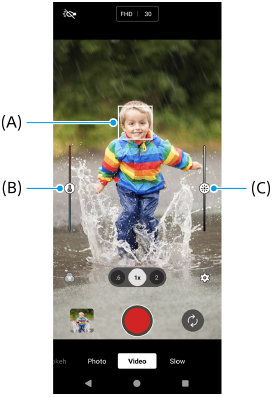 Image showing the focus frame, A, the color adjustment slider, B, and the brightness adjustment slider, C, in the viewfinder of the [Video] mode.