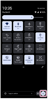 Image showing the power menu button in the bottom right of the Quick settings panel.