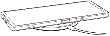 Rysunek przedstawiający ładowanie urządzenia bezprzewodowo