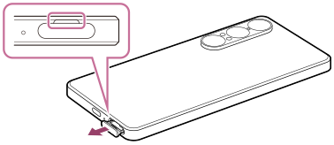 Diagram of dragging out the tray on the bottom side in rear view. The location of the notch on the device is shown.