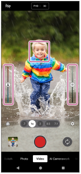 Image showing the focus frame on the subject, the color adjustment slider on the left side, and the brightness adjustment slider on the right side, in the viewfinder of the [Video] mode.