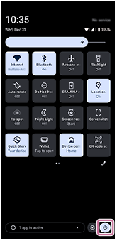 Image showing the power menu button in the bottom right of the Quick settings panel.