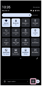 Image showing the Settings icon in the bottom right of the Quick settings panel.