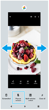 Bild som visar var man sveper för att välja en app att visa i det lilla fönstret och läget för knappen för att växla pop-up-fönster