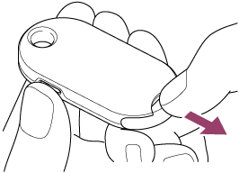 Illustration showing how to pull out the coin cell battery holder while pressing the holder release button