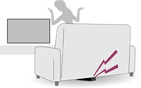Télécommande émettant un signal sonore sous un canapé